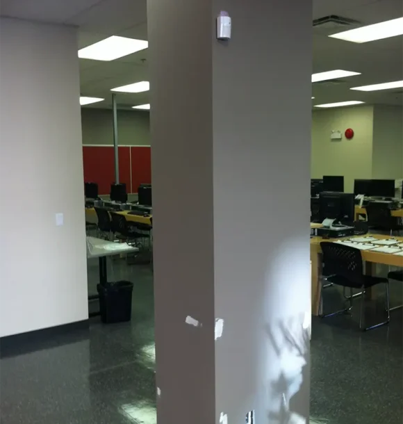 Commercial interior painting transformation of an office pillar. AZ Painting Ltd.