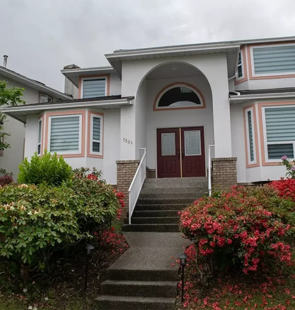 AZ Painting Ltd. exterior residential painting: white house with pink trim AZ Painting Ltd.