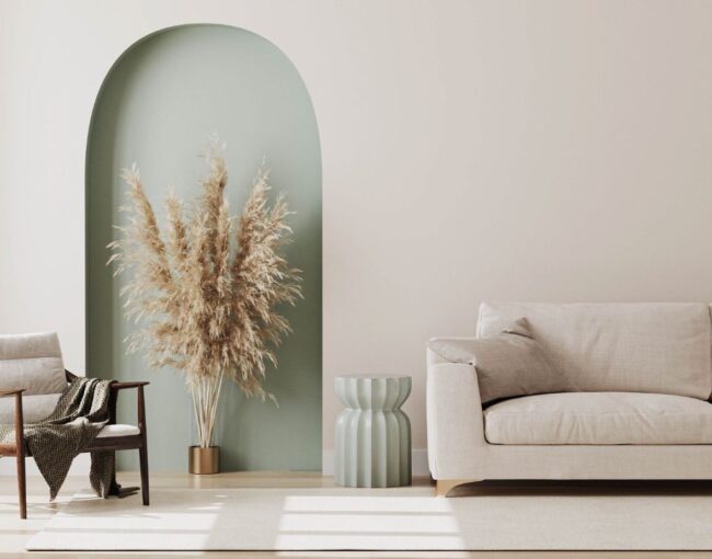 Living room with tan walls and sea green accents.